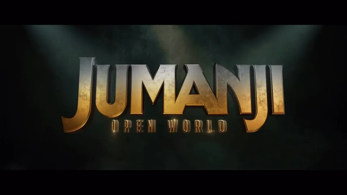 Золотий логотип Jumanji Open World на темному тлі з променями світла