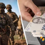 Військовий ЗСУ з автоматом і купюри 500 гривень у гаманці